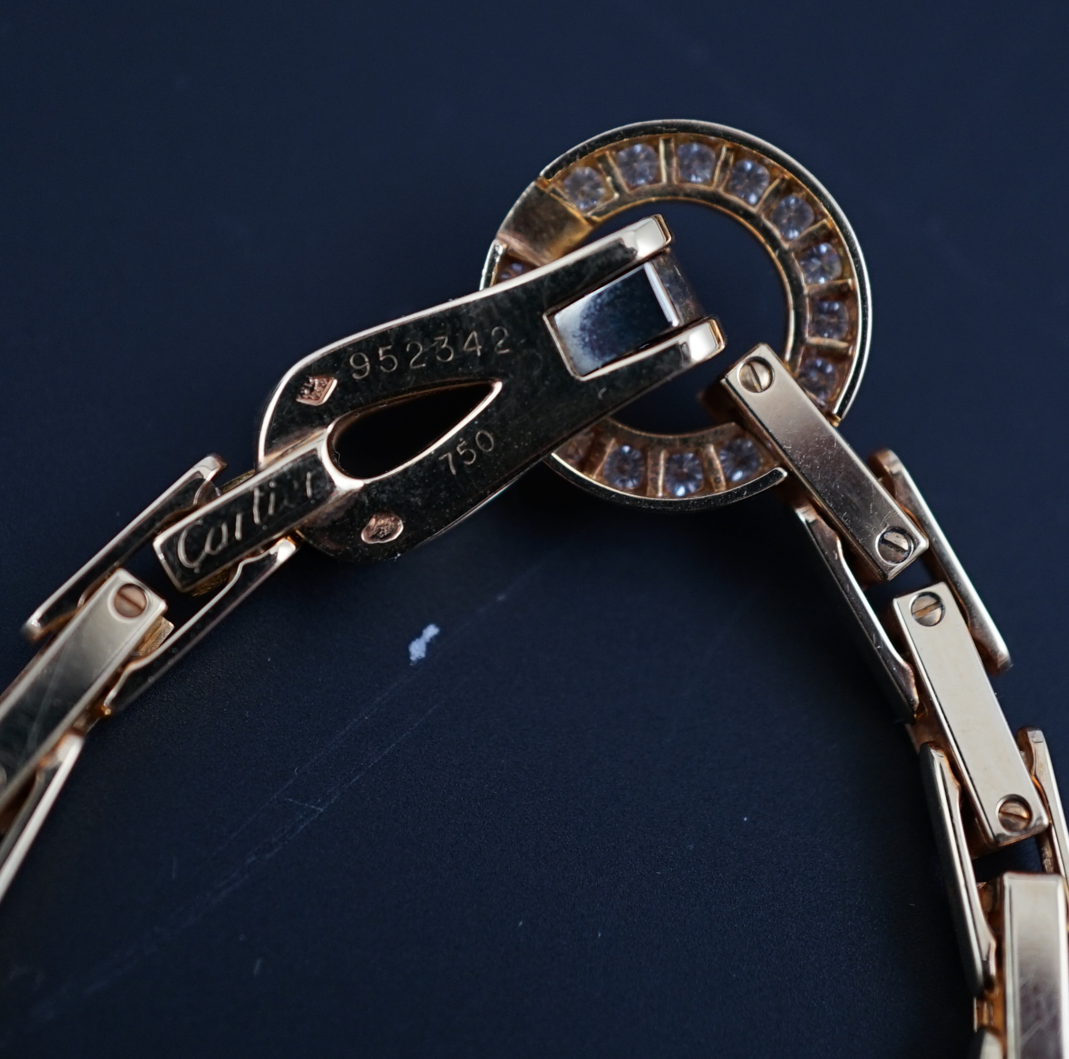 A modern Cartier 18ct gold necklace, with diamond cluster set clasp
